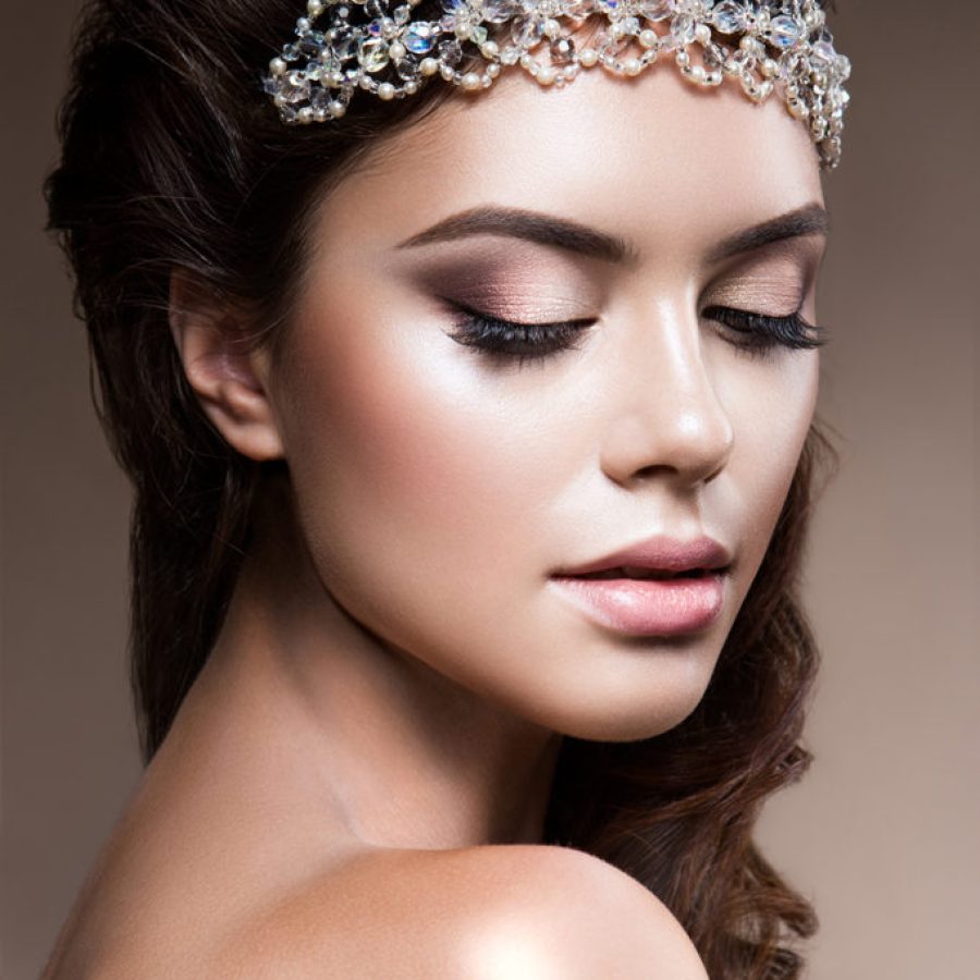 Close-up portrait of beautiful woman with bright make-up. Curly Hair. Beautiful bride.